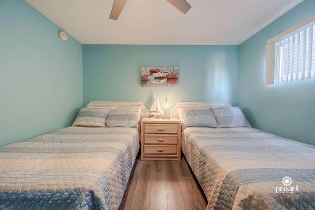 bedroom featuring light hardwood / wood-style flooring and ceiling fan