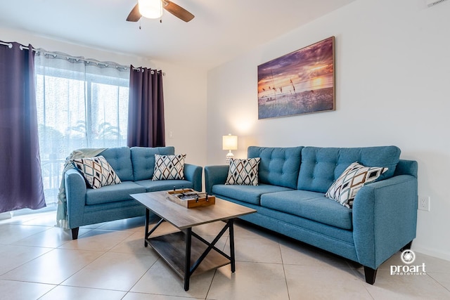 tiled living room with ceiling fan