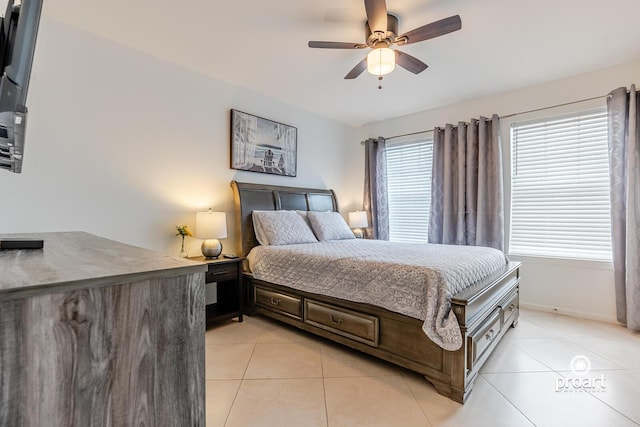 tiled bedroom featuring ceiling fan