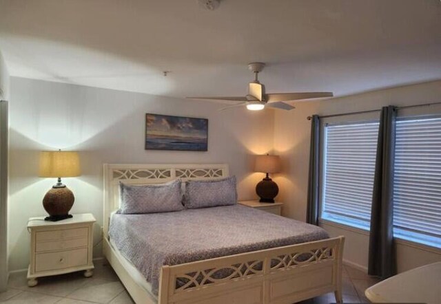 bedroom featuring ceiling fan and light tile patterned flooring