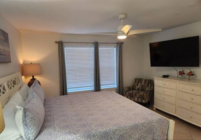 bedroom featuring ceiling fan and tile patterned flooring