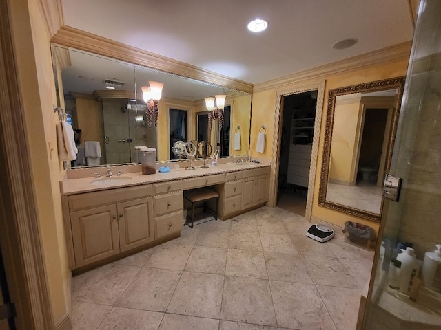 bathroom with ornamental molding, vanity, a shower with door, and tile patterned floors