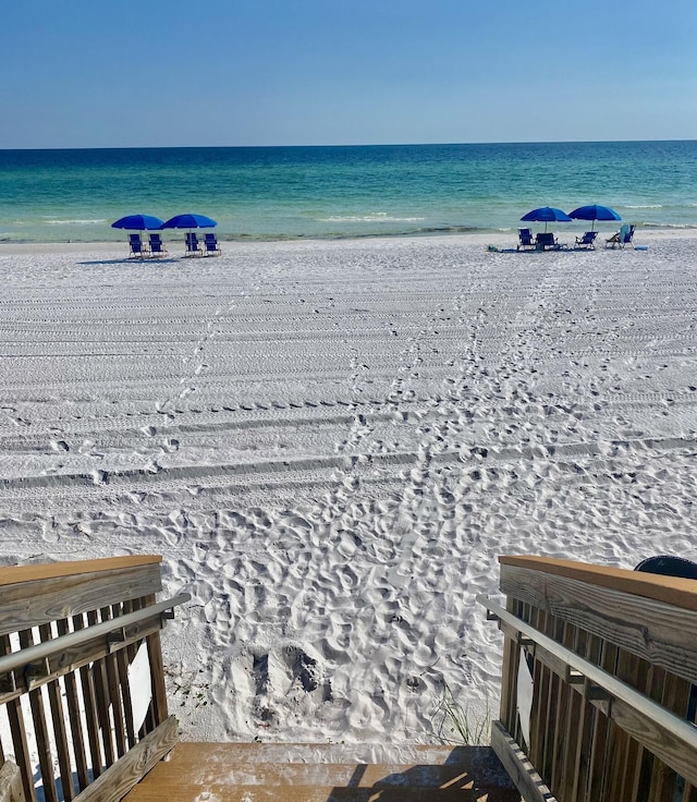 view of water feature with a beach view