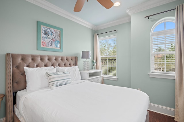 bedroom with multiple windows, crown molding, and ceiling fan