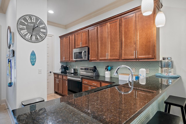 kitchen featuring dark stone countertops, backsplash, ornamental molding, and appliances with stainless steel finishes