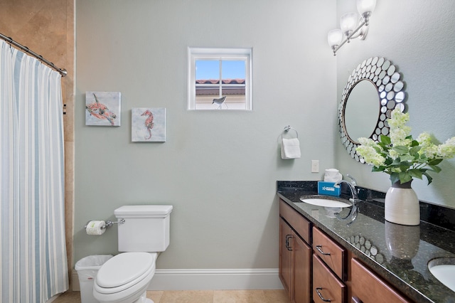 bathroom with vanity, a shower with shower curtain, tile patterned floors, and toilet