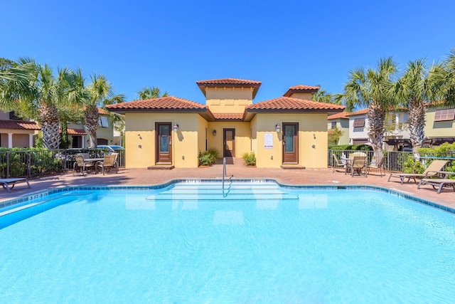 view of swimming pool featuring a patio area