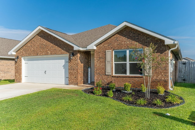 view of front of house featuring a garage and a front lawn