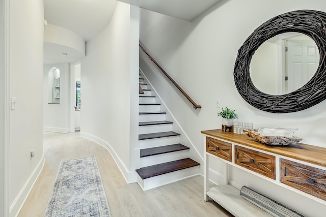 staircase with wood-type flooring