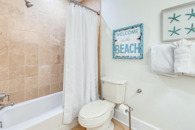 bathroom featuring toilet and shower / bath combo with shower curtain