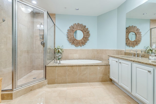 bathroom with vanity, independent shower and bath, and tile patterned flooring