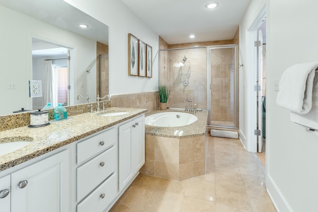 bathroom featuring vanity, tile patterned floors, and shower with separate bathtub