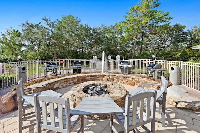 view of patio / terrace with grilling area and an outdoor fire pit