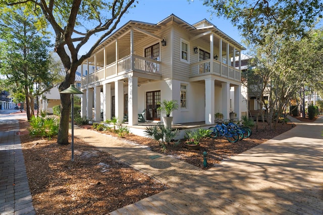 view of front of house featuring a balcony