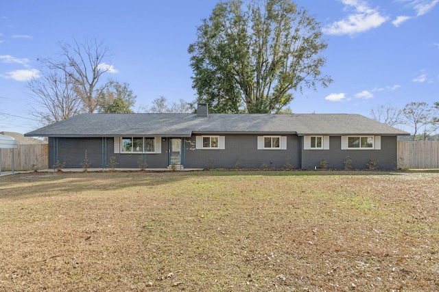 ranch-style home with a front lawn