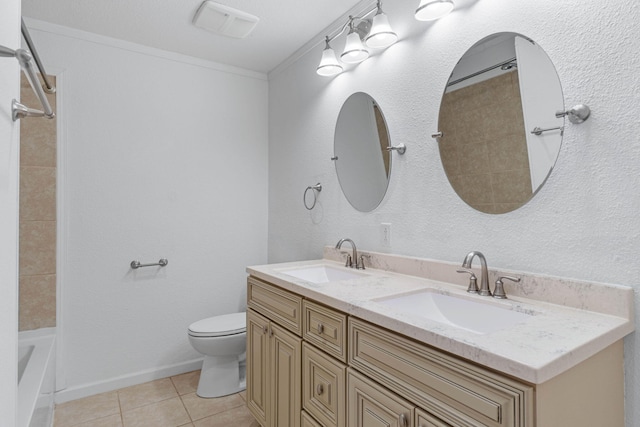 bathroom with tile patterned flooring, vanity, ornamental molding, and toilet