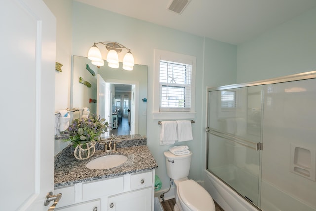 3986 W County Highway 30a Unit 231, Santa Rosa Beach, FL 32459 - bathroom featuring toilet, a notable chandelier, bath / shower combo with glass door, vanity, and visible vents