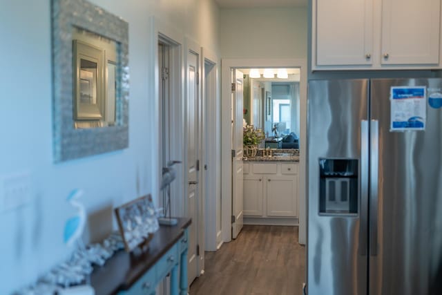 3986 W County Highway 30a Unit 231, Santa Rosa Beach, FL 32459 - kitchen featuring dark wood-style floors, stainless steel refrigerator with ice dispenser, white cabinetry, a sink, and dark stone countertops