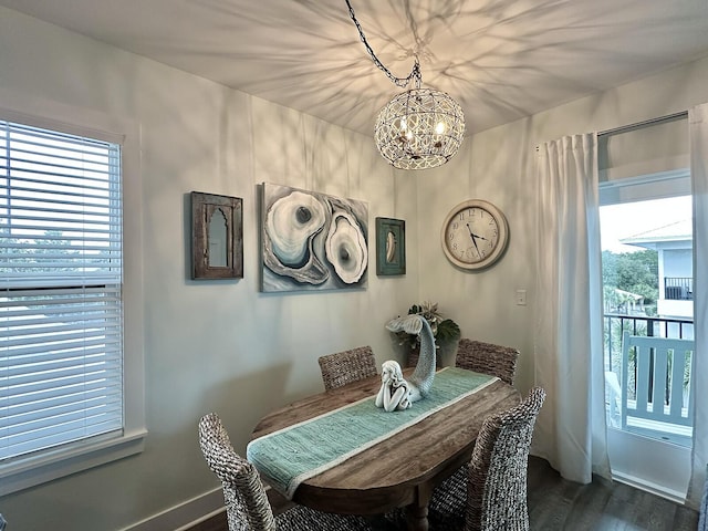 3986 W County Highway 30a Unit 231, Santa Rosa Beach, FL 32459 - dining space with a chandelier and dark wood-style flooring