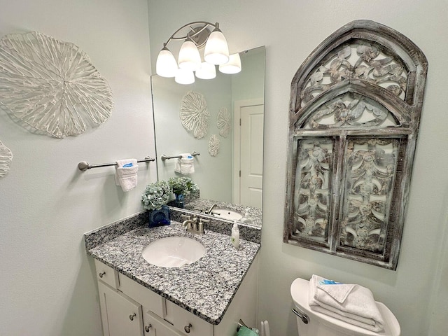 3986 W County Highway 30a Unit 231, Santa Rosa Beach, FL 32459 - half bath with a notable chandelier, vanity, and toilet