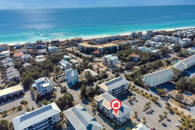 drone / aerial view with a water view and a beach view