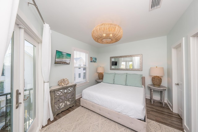 3986 W County Highway 30a Unit 231, Santa Rosa Beach, FL 32459 - bedroom featuring visible vents, baseboards, and wood finished floors