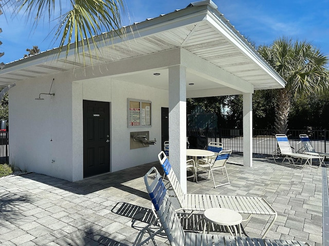 3986 W County Highway 30a Unit 231, Santa Rosa Beach, FL 32459 - view of patio featuring fence and outdoor dining space