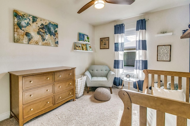 bedroom featuring light colored carpet and ceiling fan