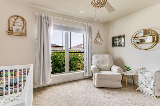 sitting room with ceiling fan, a healthy amount of sunlight, and carpet flooring