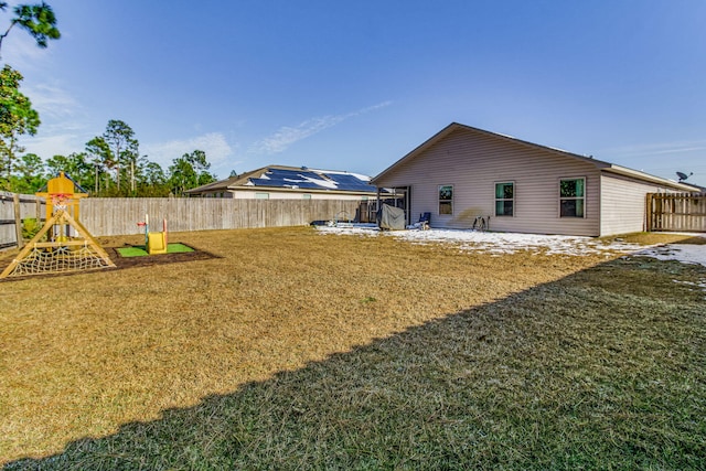 view of yard featuring a patio and a playground