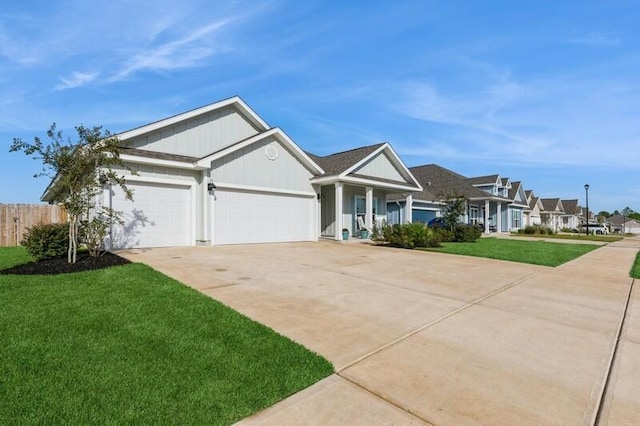 view of front facade with a garage and a front lawn