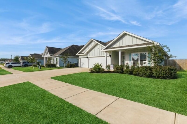 view of front facade featuring a garage, a porch, and a front yard