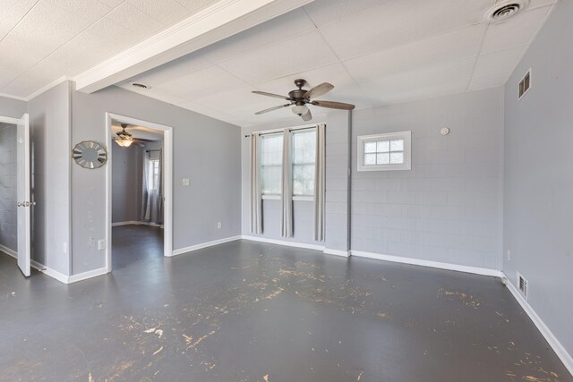 empty room with concrete flooring, visible vents, and baseboards