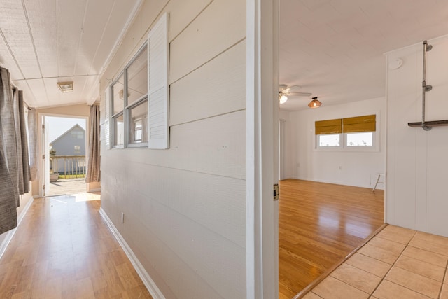 corridor with light wood-style flooring