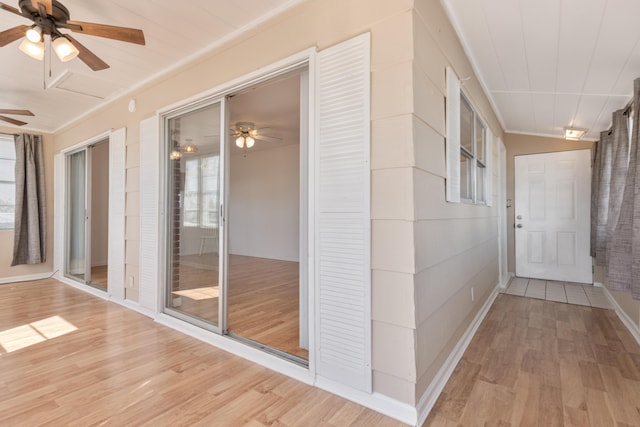 interior space featuring crown molding and wood finished floors