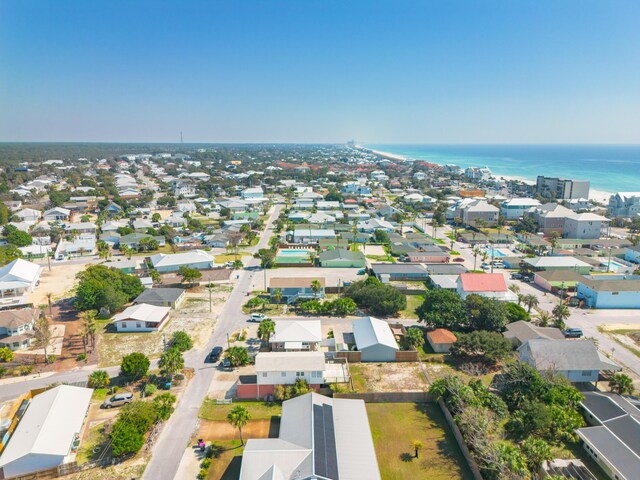 drone / aerial view with a residential view and a water view