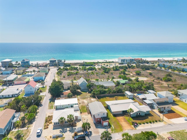 drone / aerial view with a water view and a residential view