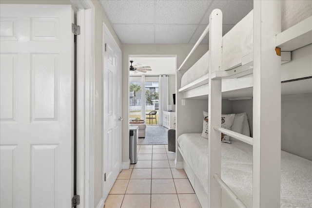 tiled bedroom with a drop ceiling