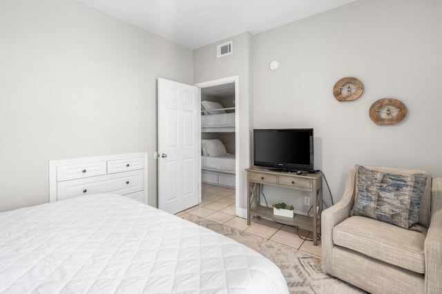 bedroom with light tile patterned floors