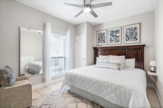 bedroom with light tile patterned flooring and ceiling fan