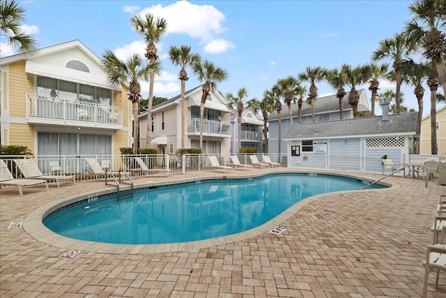 view of swimming pool featuring a patio area