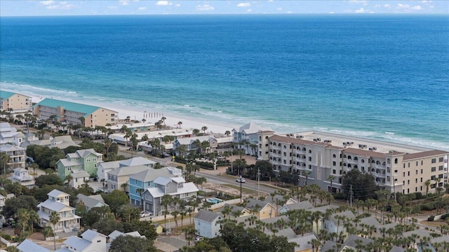 birds eye view of property with a view of the beach and a water view