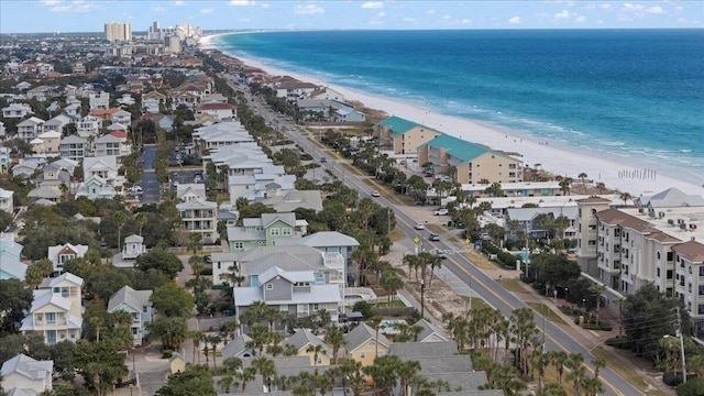 bird's eye view featuring a water view and a beach view