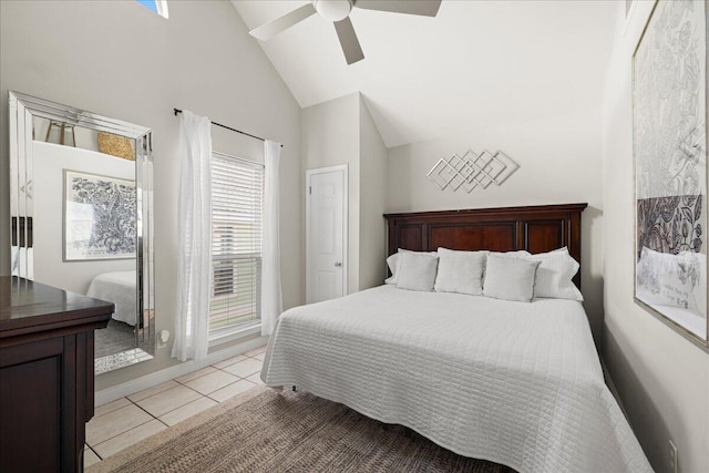 tiled bedroom with high vaulted ceiling and ceiling fan