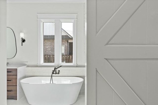 bathroom with vanity and a bathtub