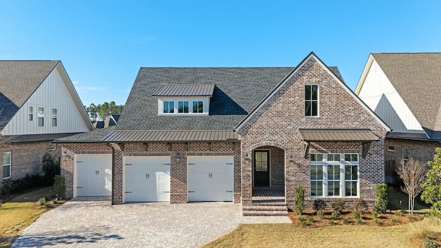 view of front of property with a garage