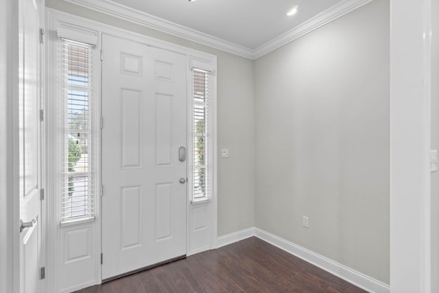 entryway featuring ornamental molding and dark hardwood / wood-style floors