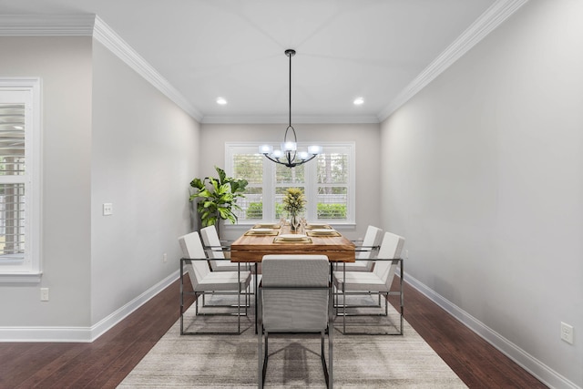 dining space with ornamental molding, dark hardwood / wood-style floors, and a chandelier