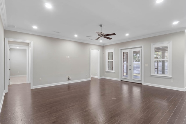 spare room featuring crown molding, dark hardwood / wood-style floors, ceiling fan, and french doors