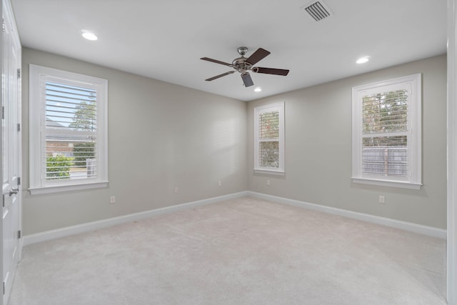 carpeted empty room featuring ceiling fan